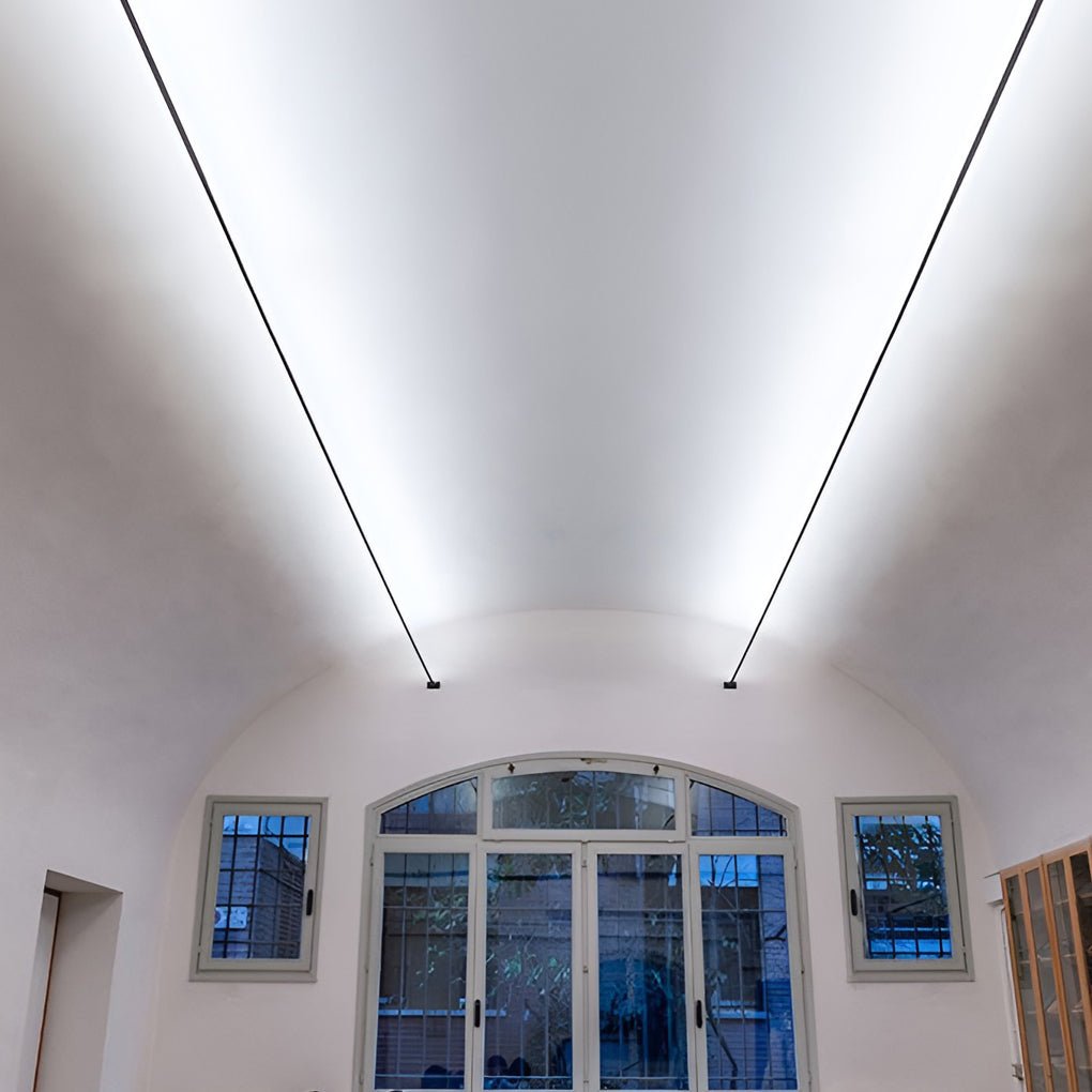 Ultra-thin linear LED light stretching across a minimalist ceiling — Skyline Line Light — Touched Home
