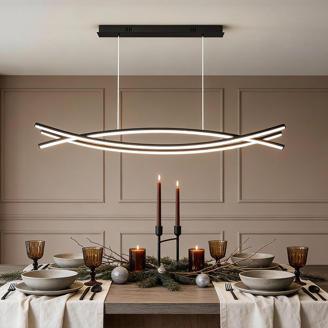 Elegant wave pendant light over a dining table – UK interior lighting trends 2025